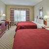 Country-Inn-and-Suites-Orlando-bedroom
